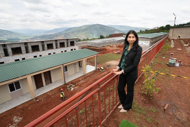 <p>Home Secretary Suella Braverman tours a building site on the outskirts of Kigali during her visit to Rwanda (Stefan Rousseau/PA)</p>