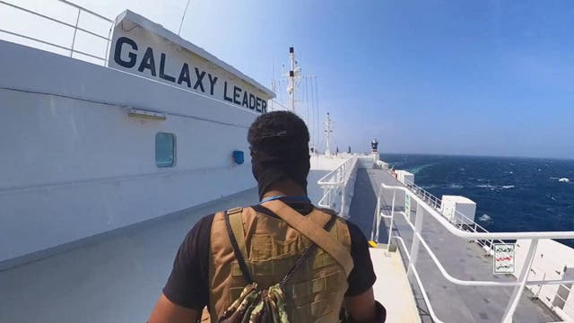 <p>This handout screen grab captured from a video shows Yemen's Houthi fighters' takeover of the Galaxy Leader Cargo in the Red Sea coast off Hudaydah, on 20 November 2023 in the Red Sea, Yemen</p>