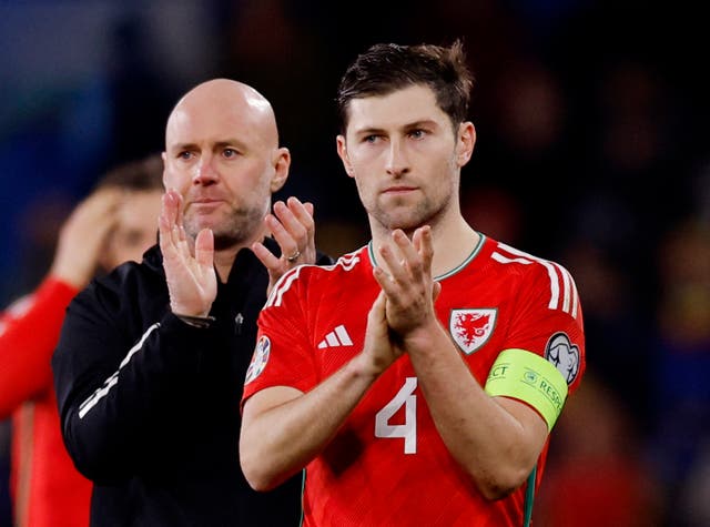 <p>Manager Rob Page with stand-in captain Ben Davies at full-time</p>