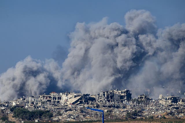<p>This picture taken from southern Israel near the border with the Gaza Strip shows smoke billowing following an Israeli strike on the Palestinian territory on 21 November 2023</p>