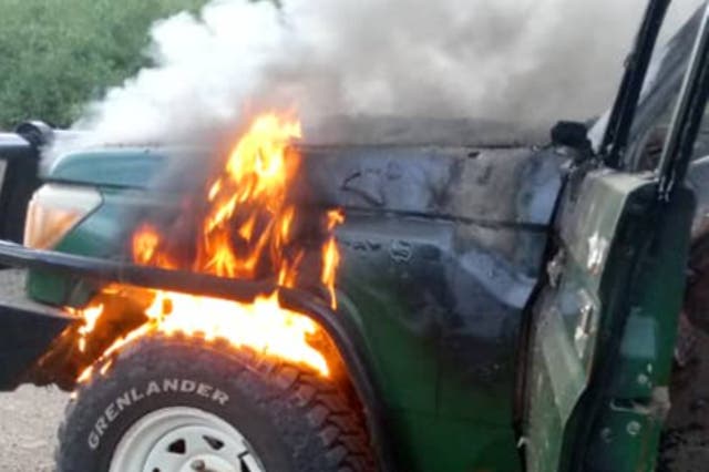 <p>The four-wheel-drive vehicle the trio was travelling in was found still on fire in the national park, with flames and plumes of smoke seen billowing off its bonnet in a picture Uganda’s police posted on its X account</p>