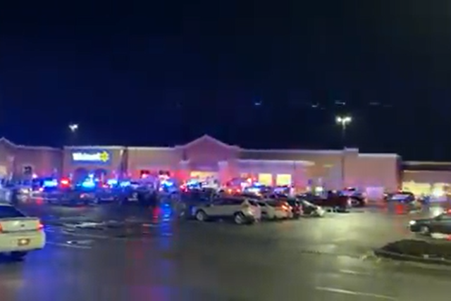 <p>A still from the outside the Walmart store in Ohio shows police vehicles arriving at the scene on Monday </p>
